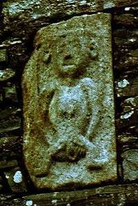 Ballynacarriga Castle (Cork): both hands pulling the vulva.